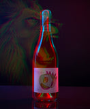 Bottle of wine with a colorful label against a dark background